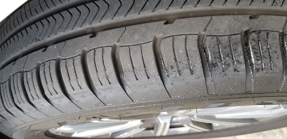What are the Common Causes Behind Tire Feathering?